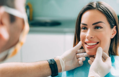 Woman being inspected by her dentist and choosing her Cosmetic Dentistry Treatment