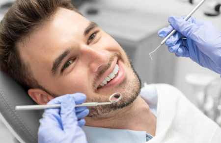 Man getting a cavities check up at the dentist