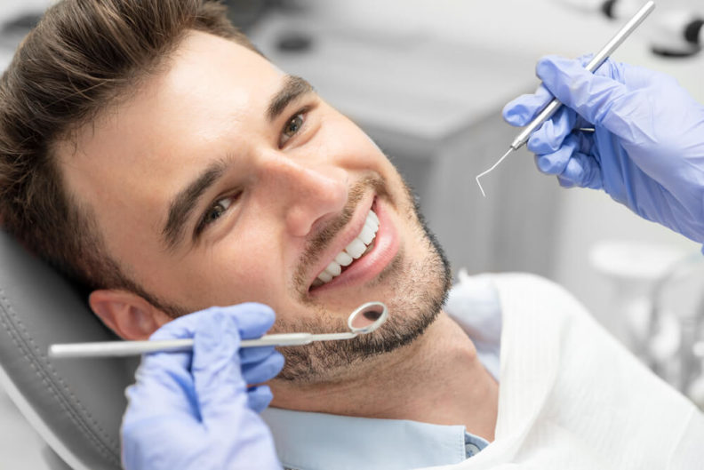 Man getting a cavities check up at the dentist