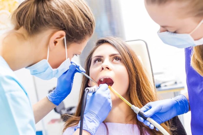 Woman at the dentist getting a cosmetic bonding procedure