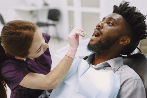 man getting a professional teeth cleaning